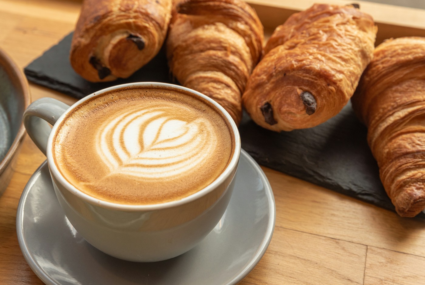 Coffee and croissants on a café table